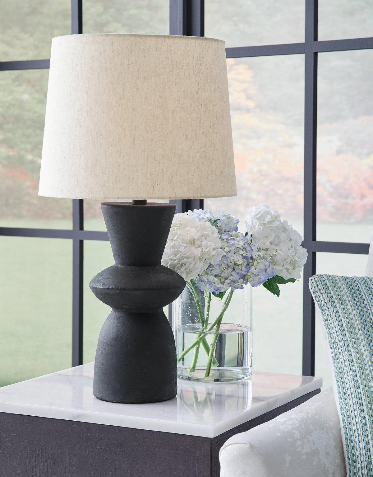 Pair of Ashley Furniture Scarbot table lamps with modern bases and fabric shades, perfect for bedside or living room decor.