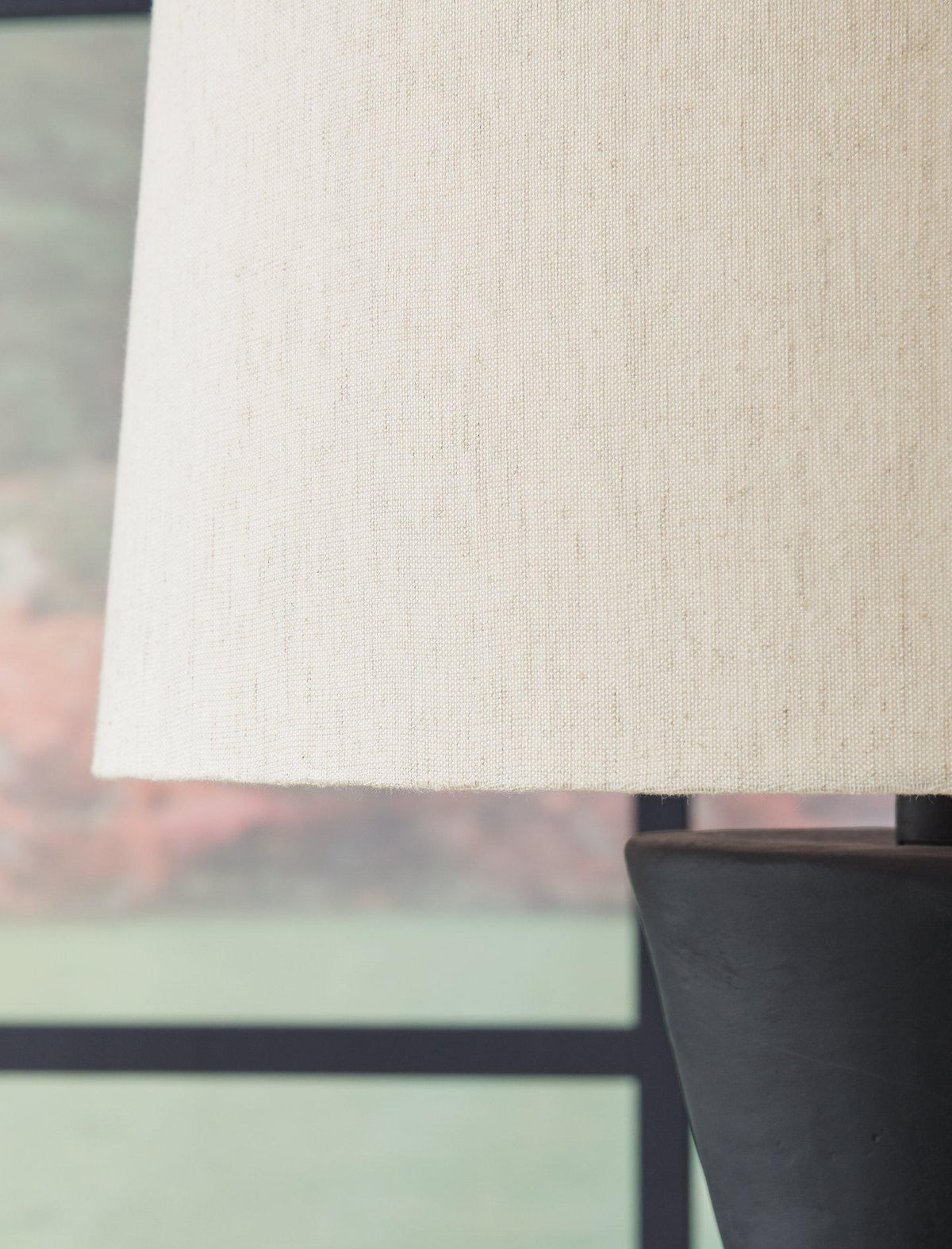 Pair of Ashley Furniture Scarbot Table Lamps featuring modern design with beige fabric shades and sleek bases.