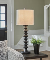 Luanndon table lamp set by Ashley Furniture featuring two elegant lamps with fabric shades and wooden bases on a wooden surface