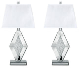 Ashley Furniture Prunella table lamp set with two stylish lamps featuring neutral fabric shades and wooden bases on a wood surface.