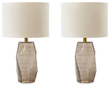 Ashley Furniture Taylor Lamp Set featuring two stylish table lamps with beige shades and decorative bases.