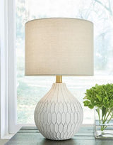 Set of two Ashley Furniture Wardmont table lamps with beige fabric shades and dark wood bases, perfect for bedside or living room.