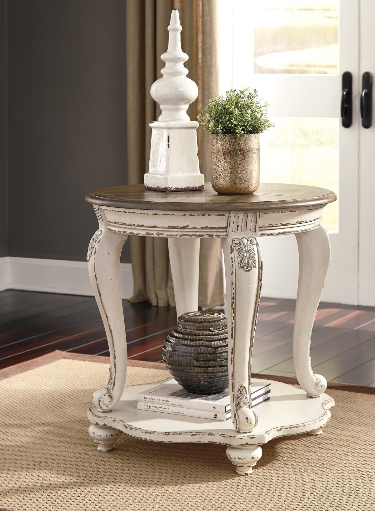 Ashley Furniture Realyn End Table Set featuring two stylish wood tables with modern design and natural finish.