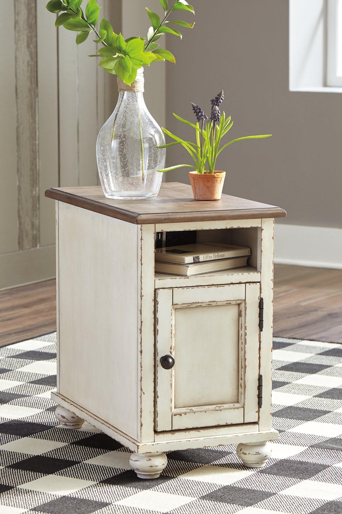 Ashley Furniture Realyn End Table Set featuring two stylish wooden tables with sleek designs and modern finishes.