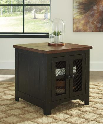 Set of two Ashley Furniture Valebeck End Tables with wooden surfaces and tapered legs, shown together in a cozy living room setting.