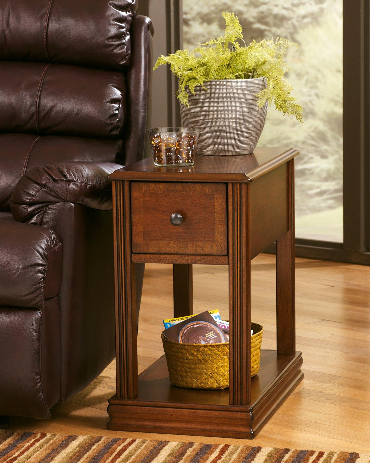 Ashley Furniture Breegin end table set featuring two stylish tables with wood finishes and modern design details.