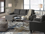 Set of three Ashley Furniture Hollynyx tables, modern table set with sleek designs and varying sizes for versatile living room decor.