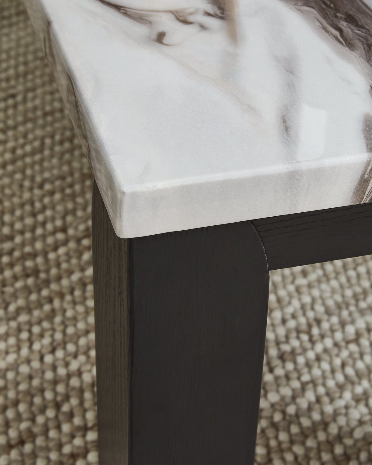 Set of three Ashley Furniture Jazmore tables with a warm finish, featuring sleek wooden surfaces and modern design.