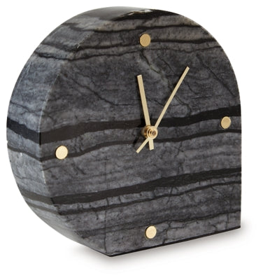Two Ashley Furniture Janmour table clocks with classic round design, black and white faces, and sleek metal bases.