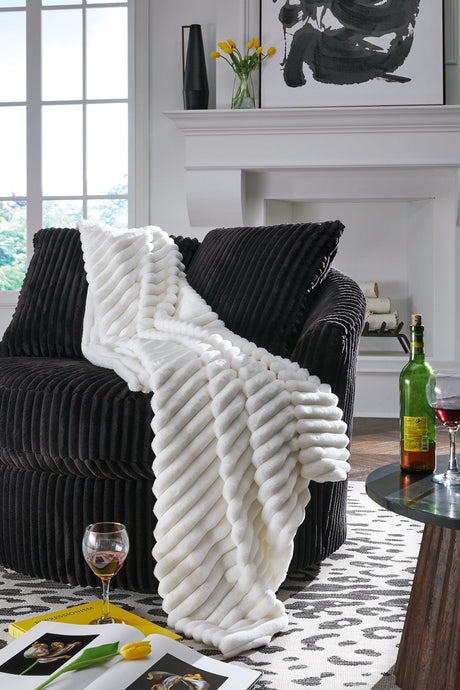 Set of three Ashley Furniture Alsonwell throws featuring soft fabric and cozy textures, perfect for added warmth and style.