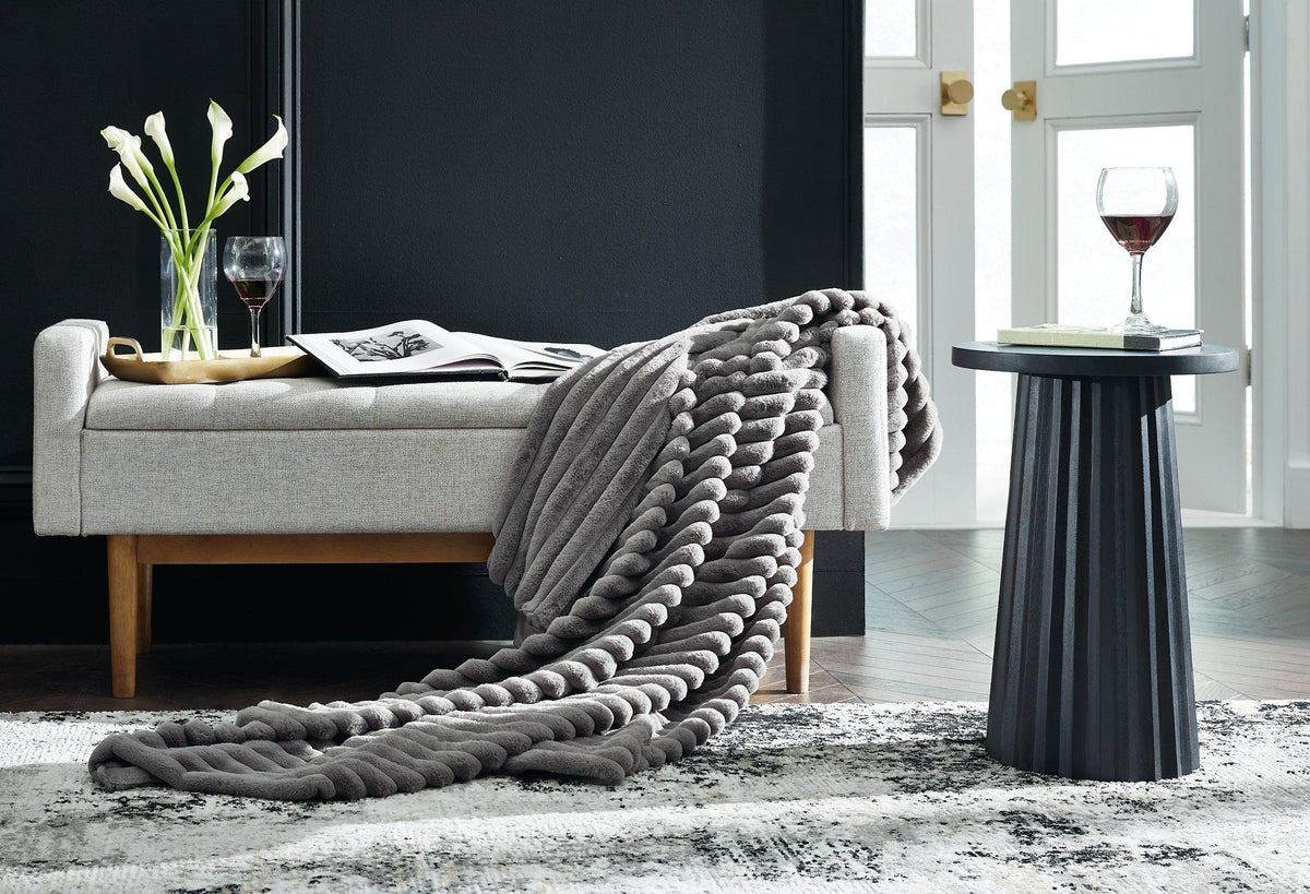 Set of three Ashley Furniture Alsonwell throws featuring soft fabric and stylish design, perfect for cozy home decor.