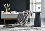 Set of three Ashley Furniture Alsonwell throws featuring soft fabric and stylish design, perfect for cozy home decor.