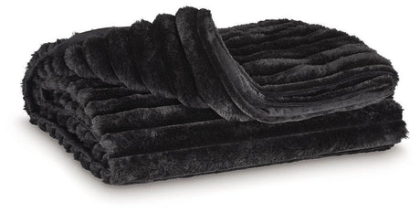 Set of three Ashley Furniture Alsonwell throws with soft, cozy fabric, neatly folded and stacked for display.