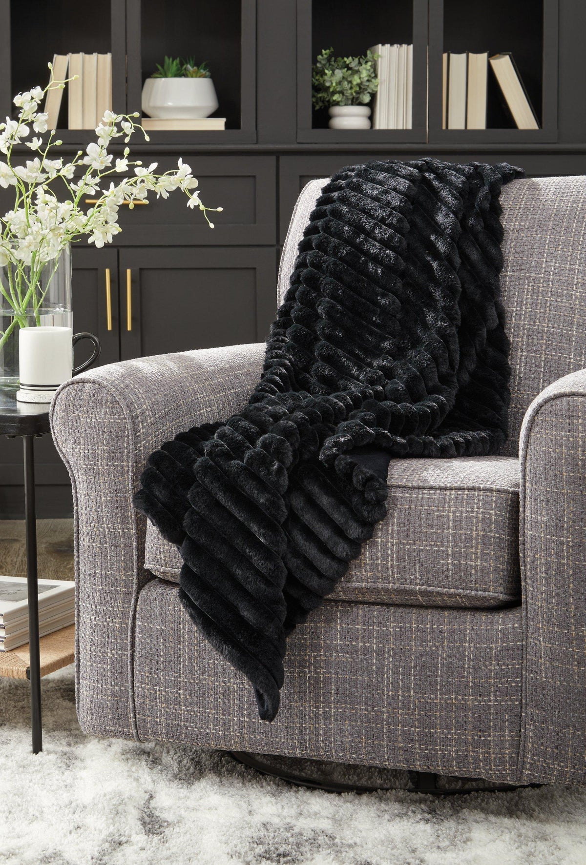 Set of three Ashley Furniture Alsonwell throws in soft, cozy fabric with textured patterns, perfect for adding warmth and style to your space.