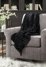 Set of three Ashley Furniture Alsonwell throws in soft, cozy fabric with textured patterns, perfect for adding warmth and style to your space.