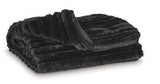 Set of three Ashley Furniture Alsonwell throws with soft, cozy fabric and decorative fringes, perfect for added warmth and style.