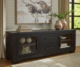 Ashley Furniture Galliden 80-inch TV stand with open shelves and storage drawers in a modern wood finish.