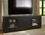 Ashley Galliden 80-inch TV stand with open shelving and storage compartments in a modern wood finish.