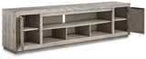 Naydell 92-inch TV stand by Ashley Furniture with spacious shelves and storage compartments in a modern wood finish.