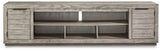 Ashley Furniture Naydell 92-inch TV stand with open shelving and storage compartments in a modern design.