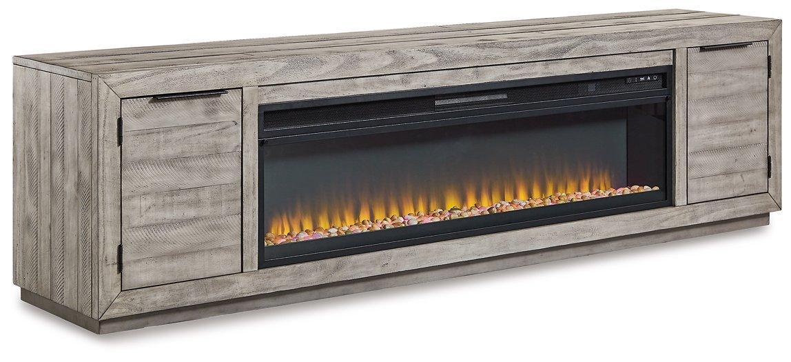 Naydell 92-inch TV stand with electric fireplace by Ashley Furniture, showcasing wood finish and integrated fireplace feature.