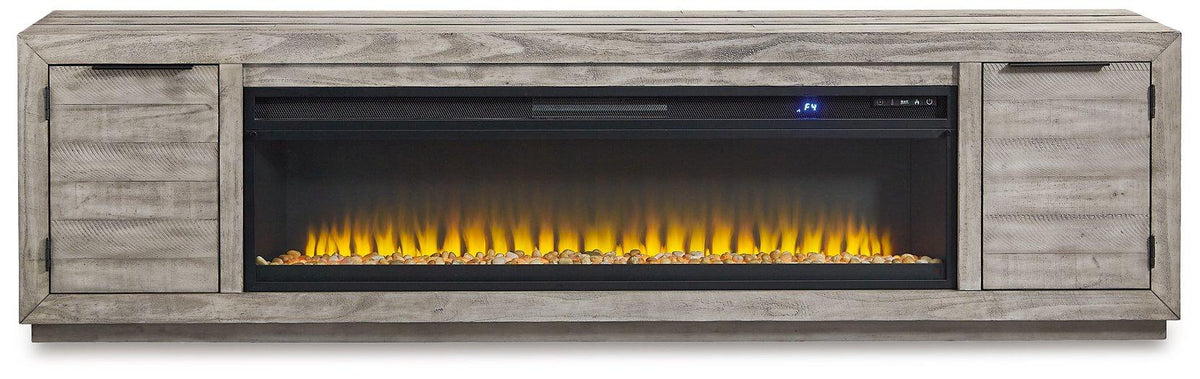 Ashley Naydell 92-inch TV stand with electric fireplace, featuring wood finish and storage cabinets for a modern living room setup.