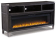 Ashley Furniture Todoe 65-inch TV stand with electric fireplace, dark wood finish, and open shelving for media storage.