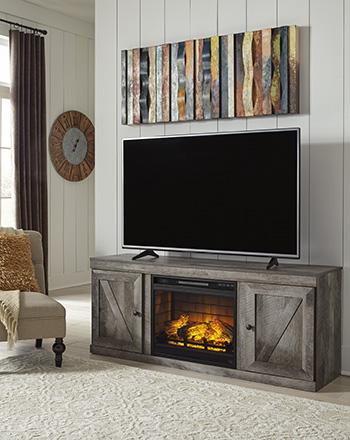 Ashley Furniture Wynnlow TV stand with built-in electric fireplace, featuring wood finish and modern design for living room entertainment.