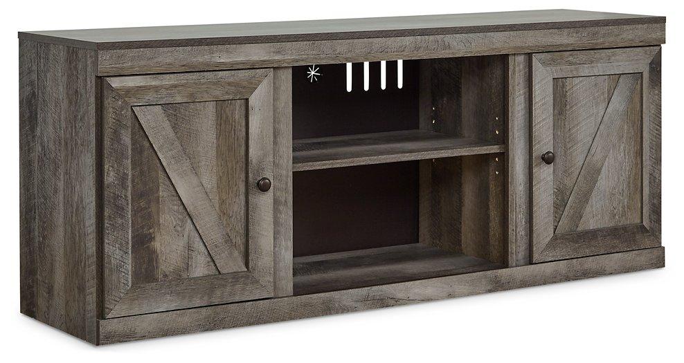 Ashley Furniture Wynnlow TV stand with electric fireplace, showcasing a modern black wood finish and built-in fireplace insert.