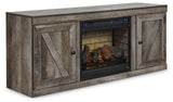 Ashley Furniture Wynnlow TV Stand with electric fireplace, modern design, wood finish, and built-in fireplace for cozy living rooms.