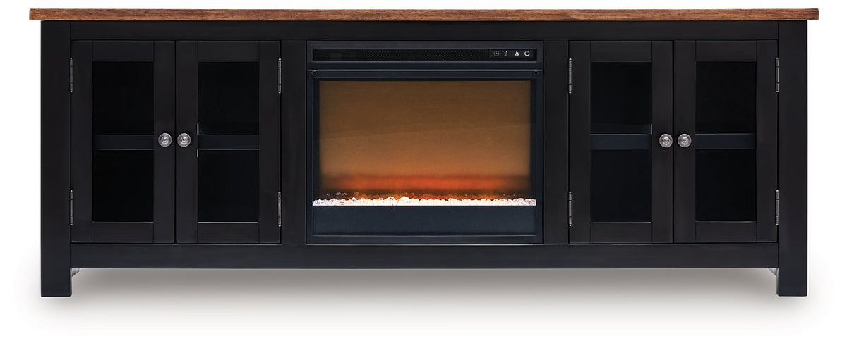 Ashley Furniture Wildenauer 76-inch TV stand with electric fireplace, wood finish, and modern design, shown from front perspective.