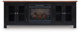 Wildenauer 76-inch TV stand with electric fireplace by Ashley Furniture, featuring a modern wood finish and built-in fireplace.
