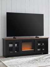 Wildenauer 76-inch TV stand with electric fireplace from Ashley Furniture, featuring a modern design and media storage.