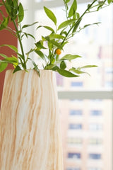 Detailed view of the Ashley Furniture Cammen Vase, a stylish decorative ceramic vase with textured surface and neutral finish.