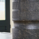 Ashley Furniture Beninworth Vase with intricate patterns and a glossy finish, displayed on a neutral surface.