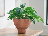 Ashley Furniture Orban Vase, decorative ceramic vase with textured design, shown in a natural setting.
