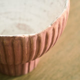 Ashley Furniture Orban Vase, decorative ceramic vase with a textured finish and neutral color, displayed on a wooden surface.