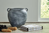 Ashley Furniture Meadie Vase with a sleek, modern design, showcasing a smooth, neutral-colored ceramic surface.