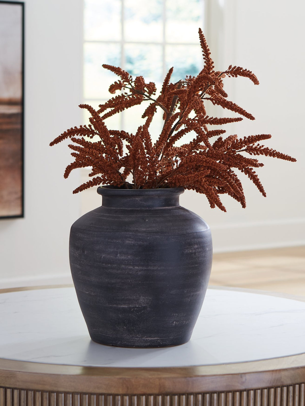 Ashley Furniture Meadie Vase with a sleek, modern design perfect for home decor, shown in a close-up image.