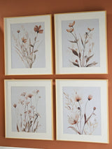 Set of four Chettings Wall Art pieces by Ashley Furniture featuring modern abstract designs in vibrant colors.