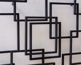Ashley Furniture Aadanton wall decor featuring elegant metal accents and a modern design for stylish home decoration.