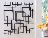 Ashley Furniture Aadanton wall decor featuring a modern, abstract design for stylish home accent.