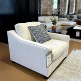 Behold Home Fairhaven Accent Chair with plush upholstery and wooden legs, shown in a cozy living room setting.