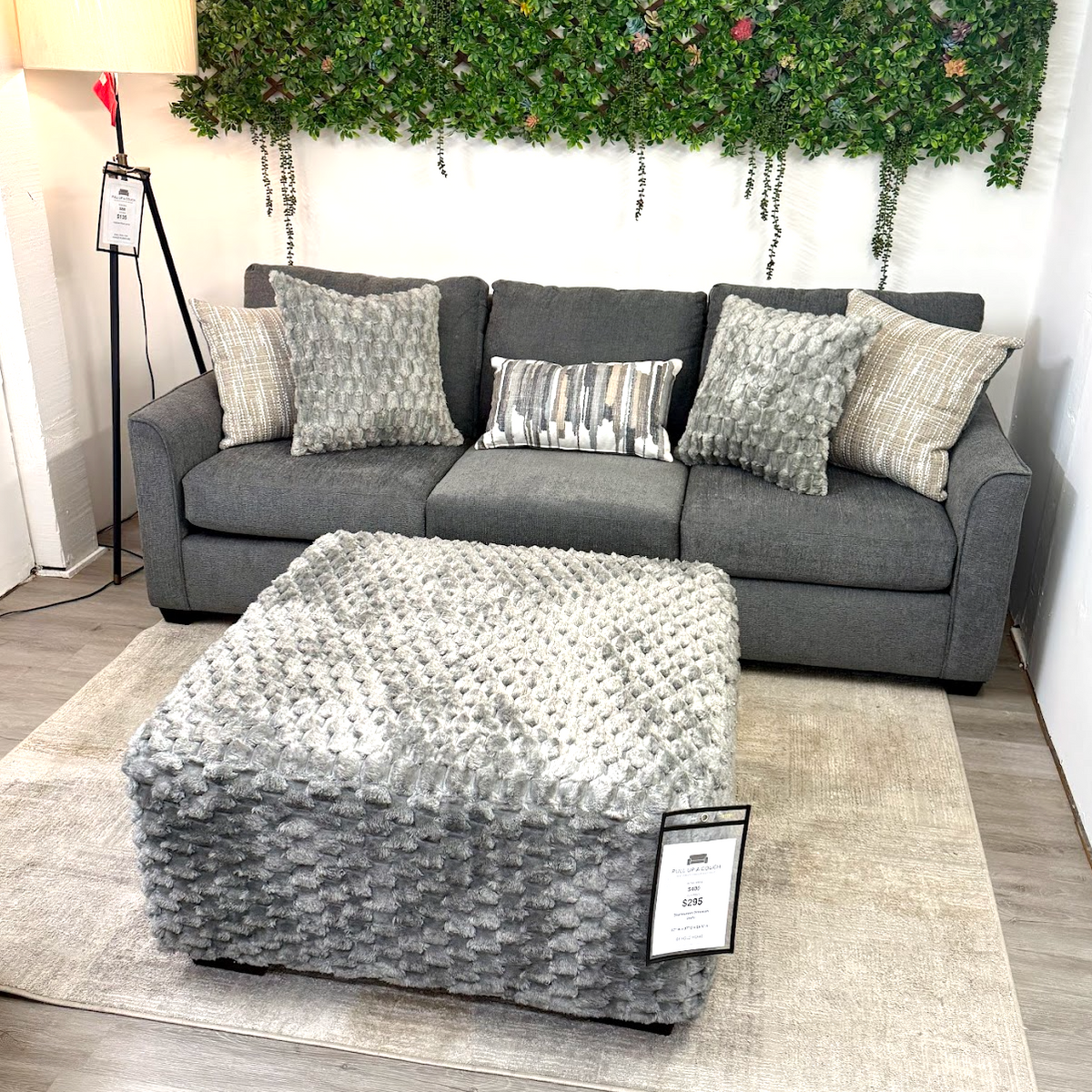 Charcoal Behold Home Mayfield sofa with built-in drop-down table, modern design, and plush upholstery.