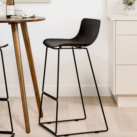 Black MCM indoor/outdoor barstool by Article with a sleek modern design and sturdy metal frame.