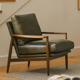 Green leather MCM chair by Article with sleek modern design and plush cushioning, perfect for stylish living spaces.