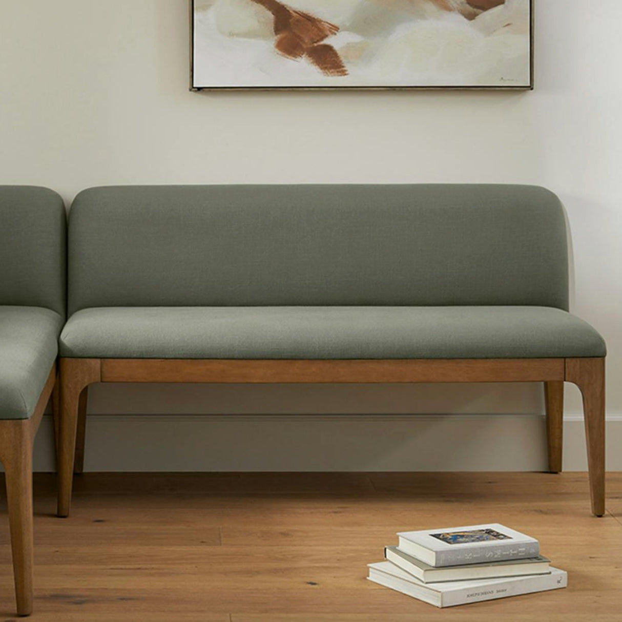 Welsh Green Armless Dining Banquette by Article, showcasing a sleek, armless dining chair with a vibrant green fabric upholstery.
