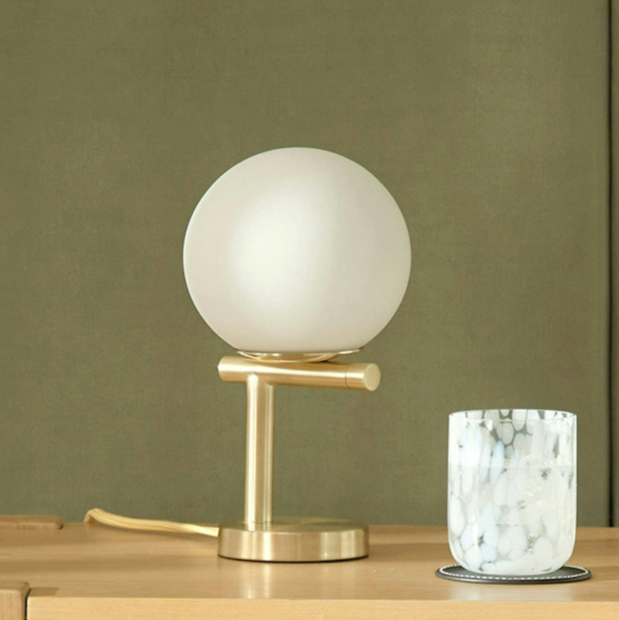 Gold MCM Table Lamp by Article with a sleek modern design and a cylindrical base, ideal for contemporary decor.
