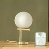 Gold MCM Table Lamp by Article with a sleek modern design and a cylindrical base, ideal for contemporary decor.
