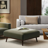 Felted green MCM-style square ottoman by Article with clean lines and plush felted surface, perfect for modern living rooms.